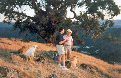 Buster and Charlie on a hillside with Jim