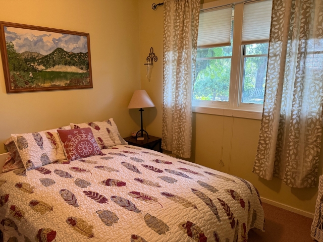 The bed looking toward the window